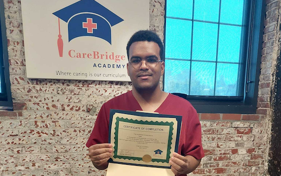CNA An Insight PA student who recently completed his Certified Nurse Aid (CNA) holds up his certificate of completion.