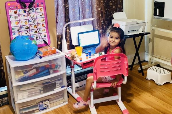 Insight Student An Insight PA student waving to the camera while learning from home.