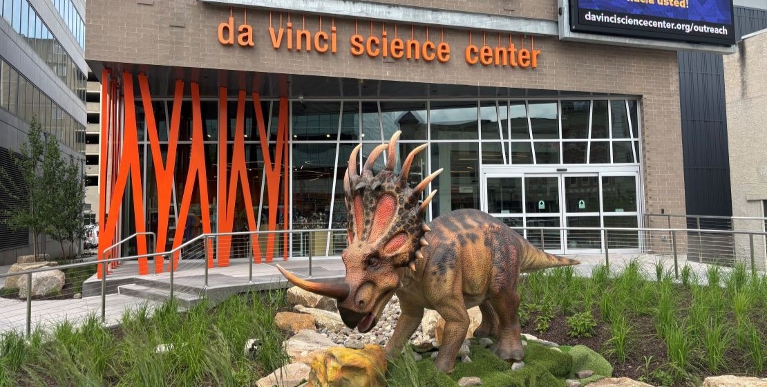 A model dinosaur in front of the Da Vinci Science Center at PPL Pavilion.