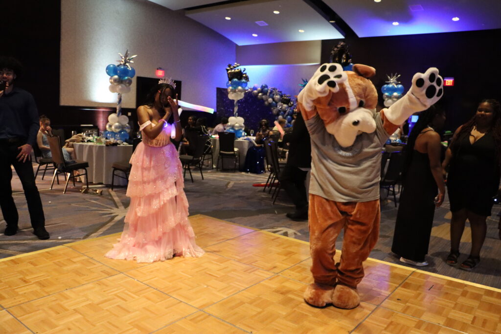 Insight PA students and Barkley the Bulldog dance at the Insight PA’s Prom in Lancaster, PA.
