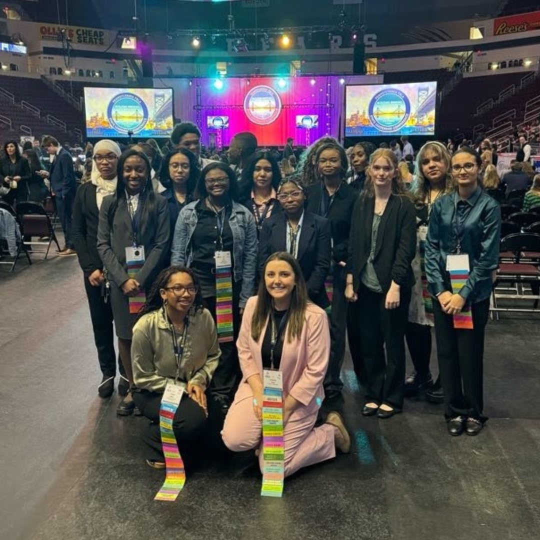 A group of Insight PA students in formal attire at an FBLA event.