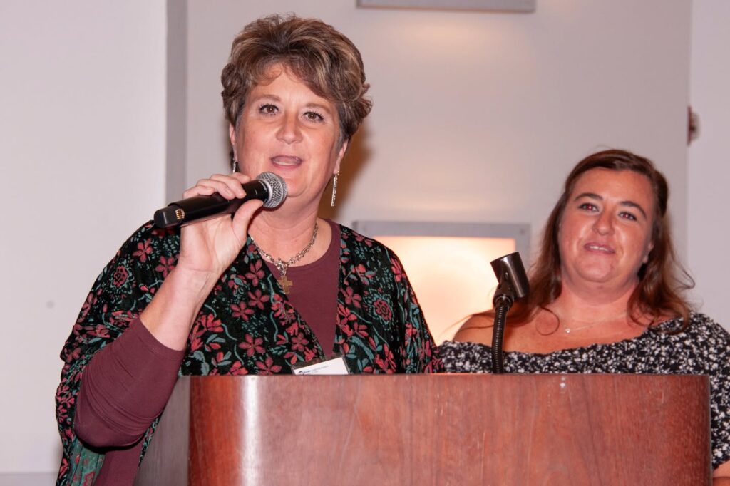 Beth Habbyshaw and Christina Sowa, HS Transition Coordinators, speak on a podium at the Heinz History Center in Pittsburgh, PA